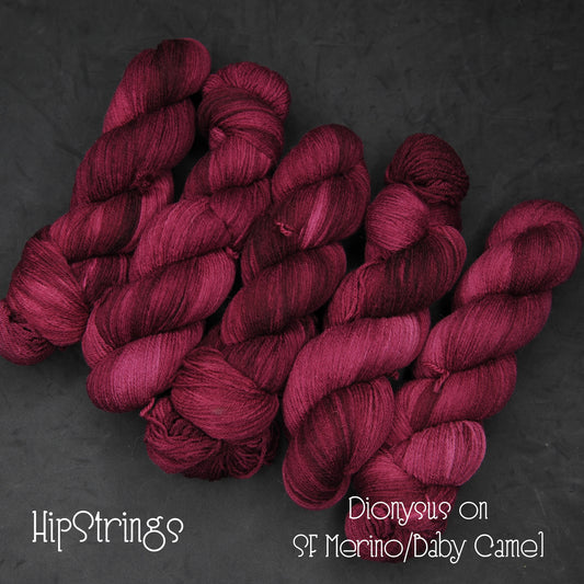 Dionysus on Hand Dyed Ivory Tower Superfine Merino and Baby Camel Fingering Weight Yarn - 437 yd/100g