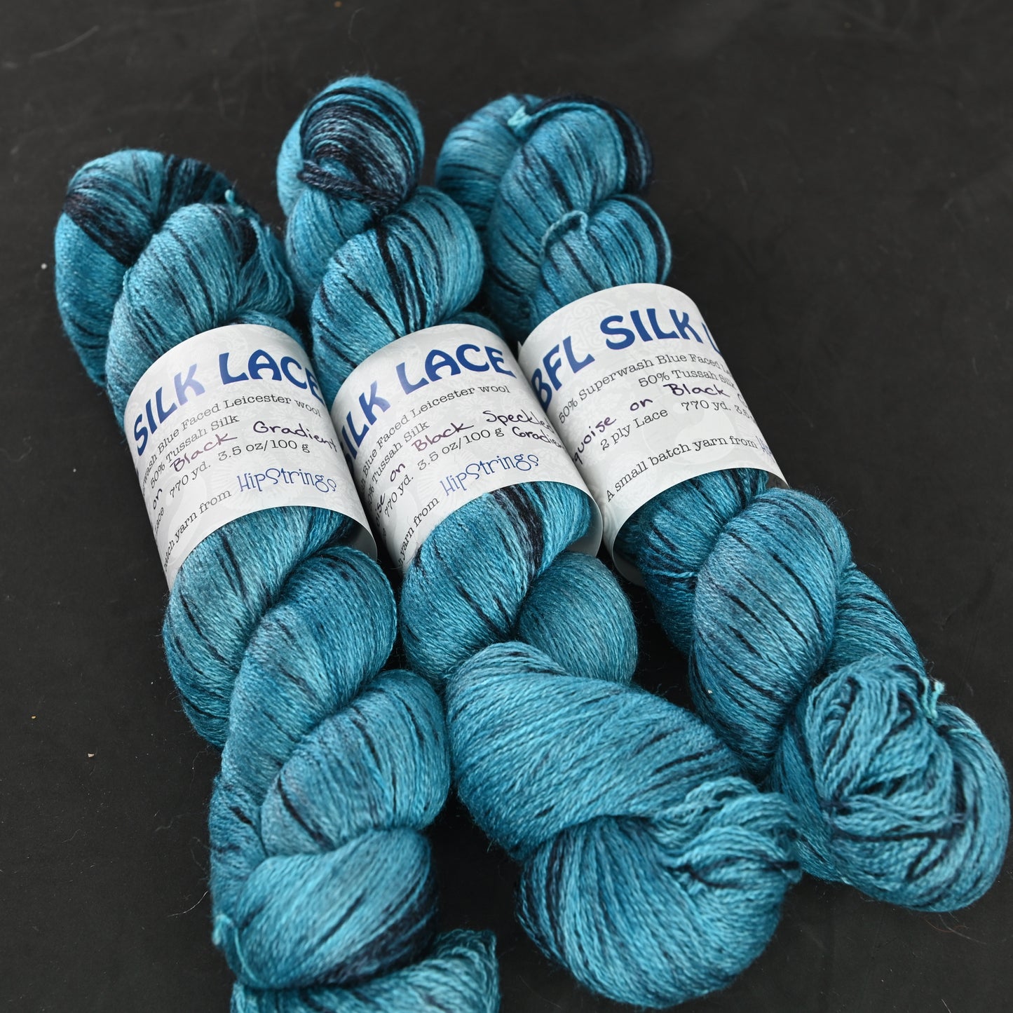 Turquoise on Black Gradient on Hand Dyed SW BFL Silk Lace Yarn - 100g